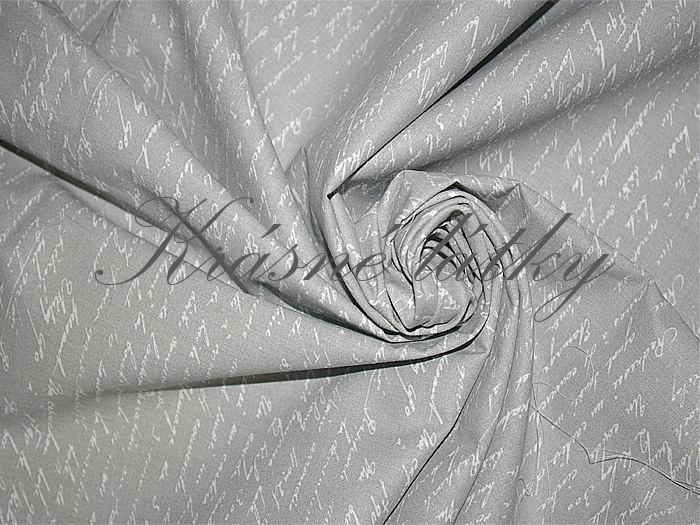 Bavlněná látka písmo na šedém pozadí