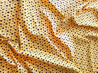 Bavlněný úplet žluto černé ovály, dětské látky metráž